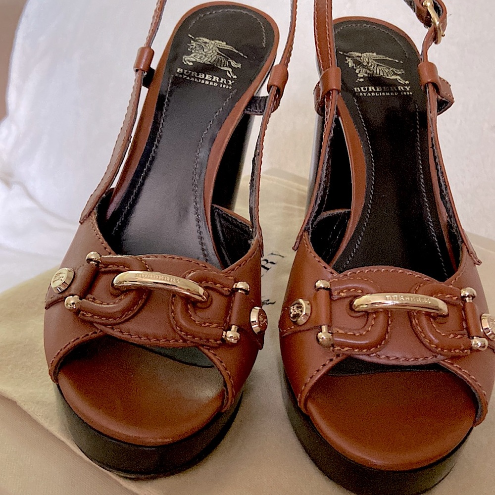 Authentic BNIB Burberry platforms. Rich Brown colour with gold horse bit detail.
